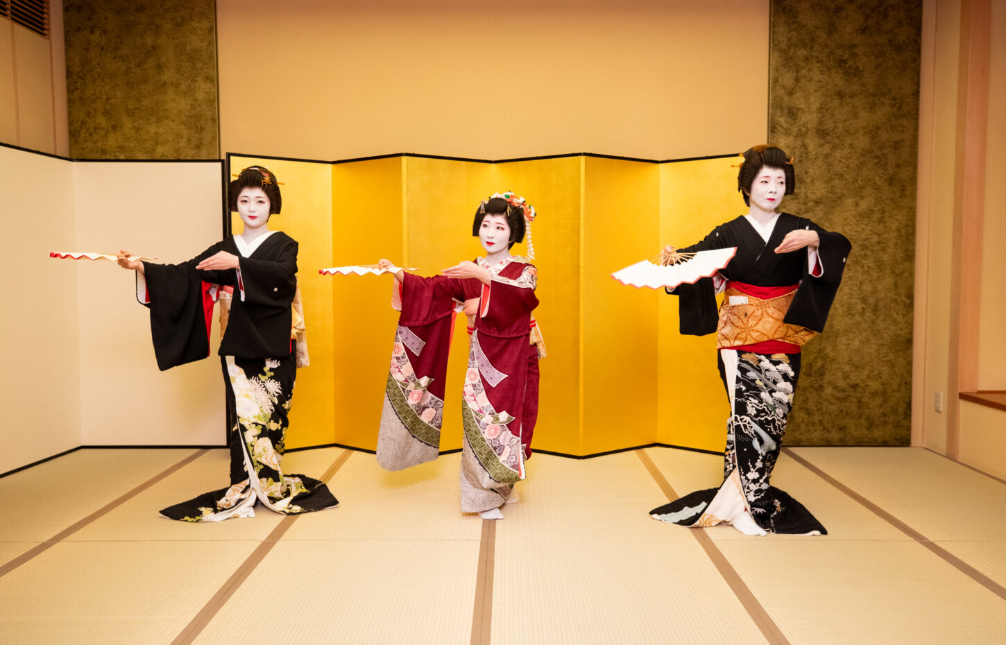 Geisha performing traditional Japanese dance at a private ozashiki banquet in Asakusa, Tokyo