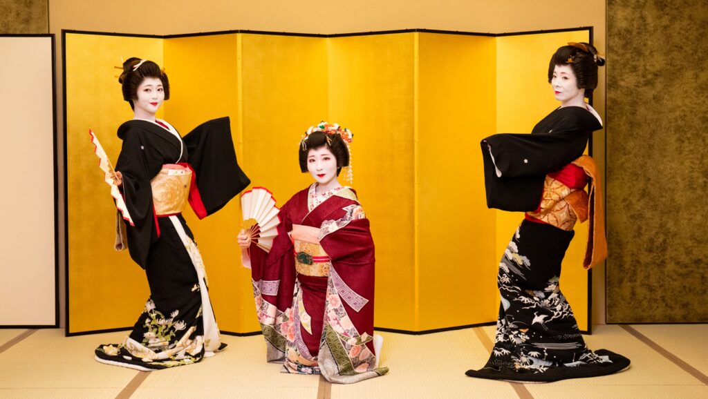 Geisha wearing formal kimono during a traditional dance