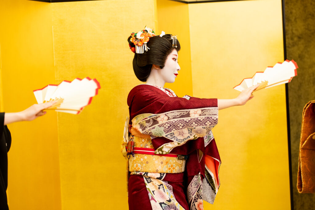 Geisha performing Nihon Buyo classical dance in a traditional tatami room