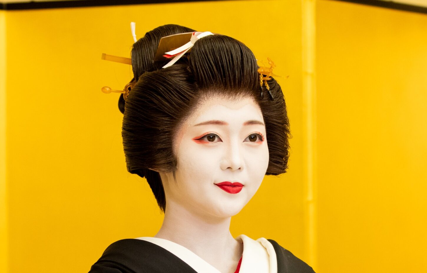 Geisha portrait with traditional white makeup
