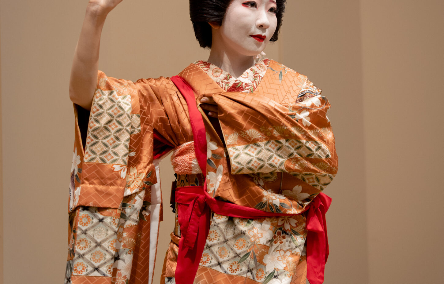 Authentic geisha performing traditional dance in Tokyo tatami room