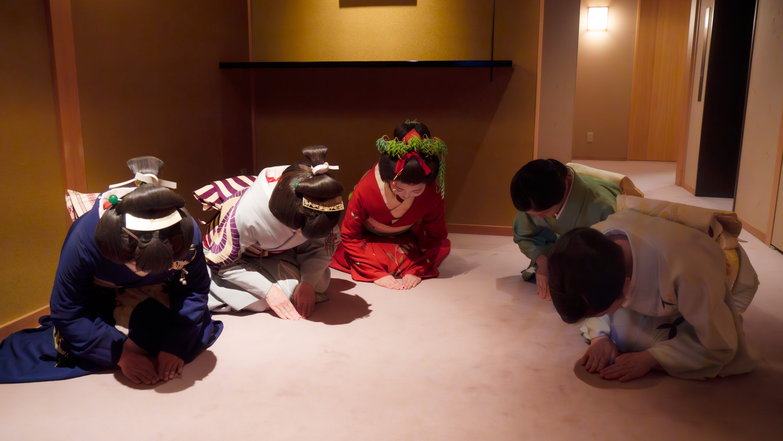 Geisha bowing gracefully in a tatami room representing traditional Japanese etiquette