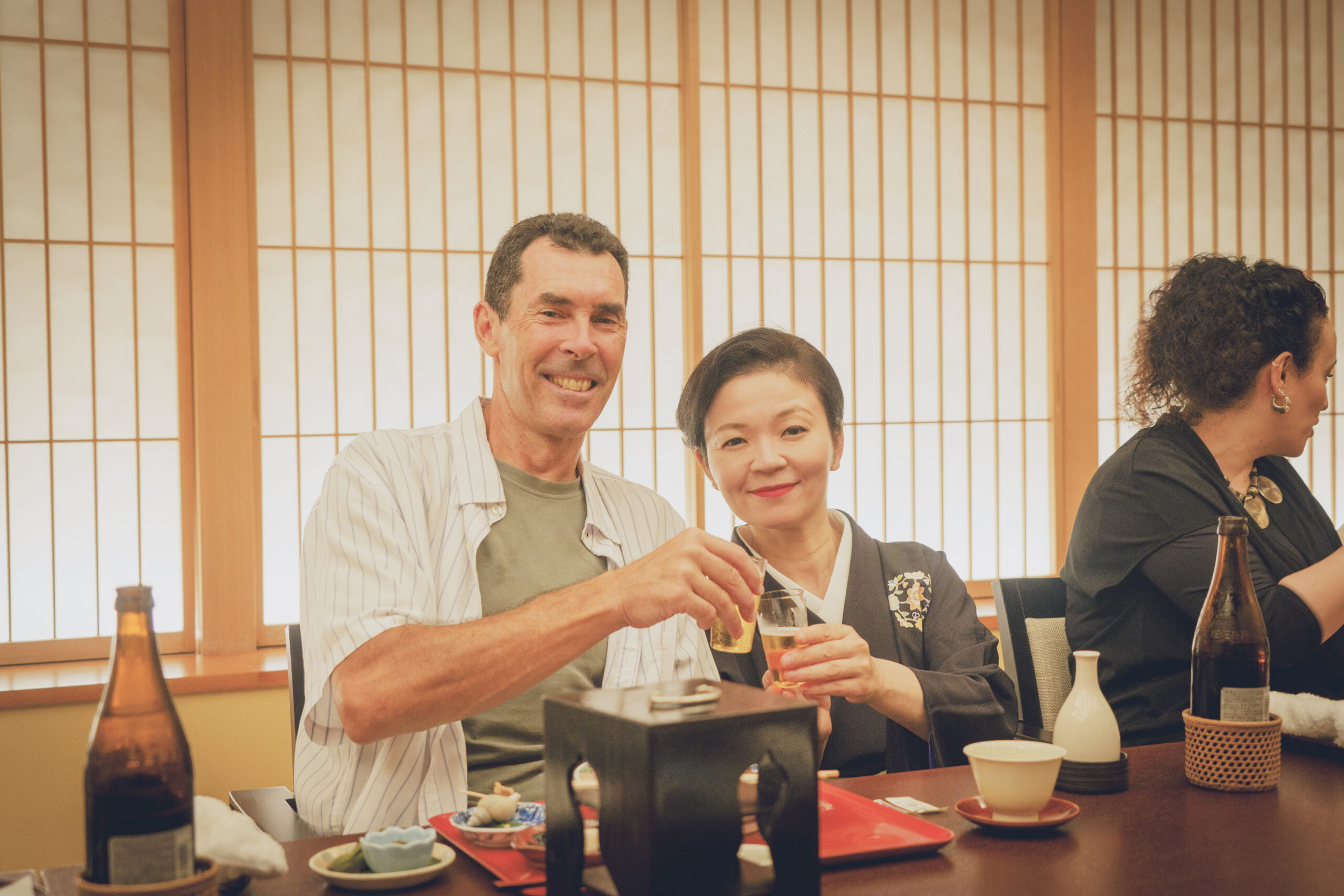 Guests enjoying a traditional geisha dinner in a private room with kaiseki cuisine