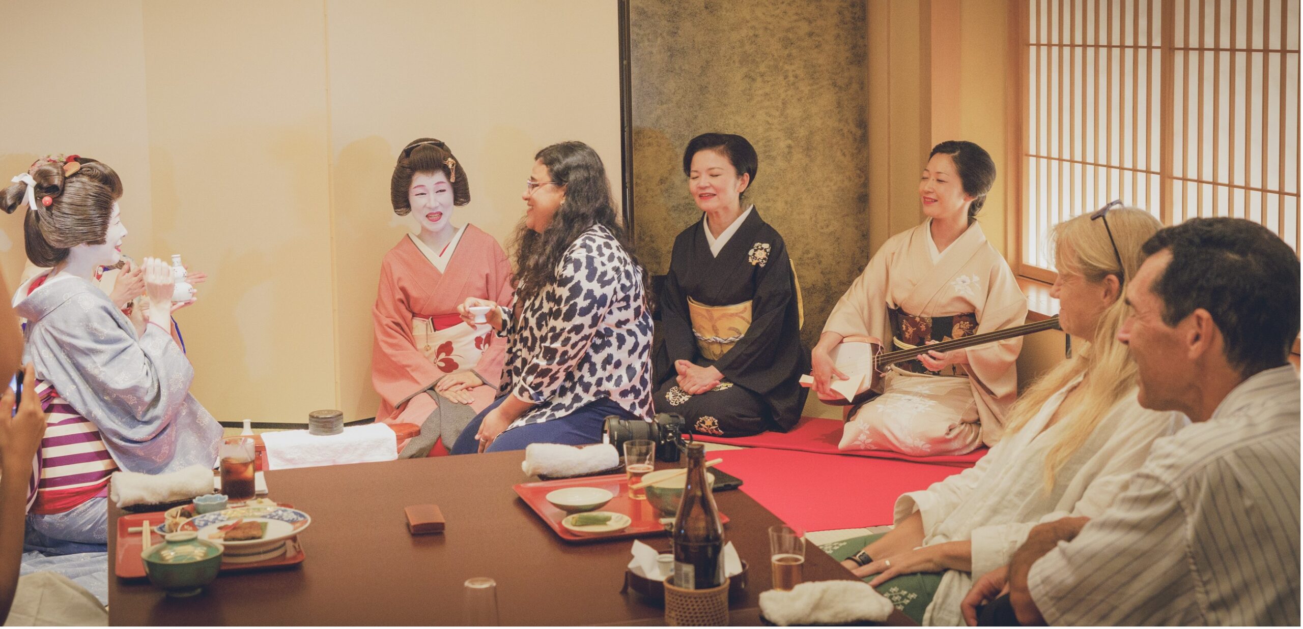 Laughter during traditional geisha banquet games at Miyakodori