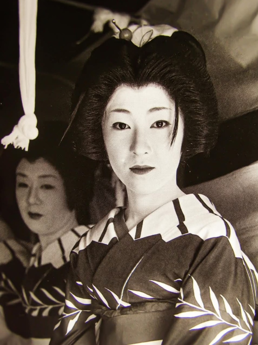 Okami Chikage in her early years as a geisha, around age 20, in traditional kimono