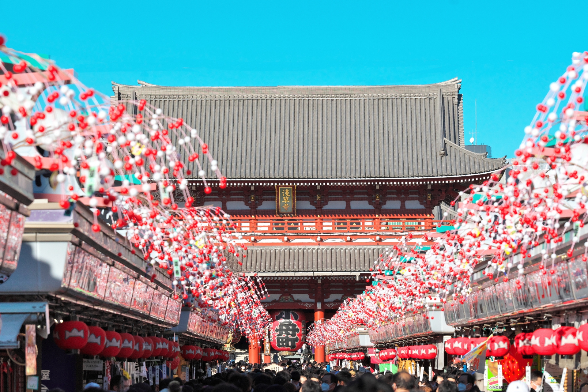 Colorful Nakamise Dori shopping street lined with traditional stalls in Asakusa