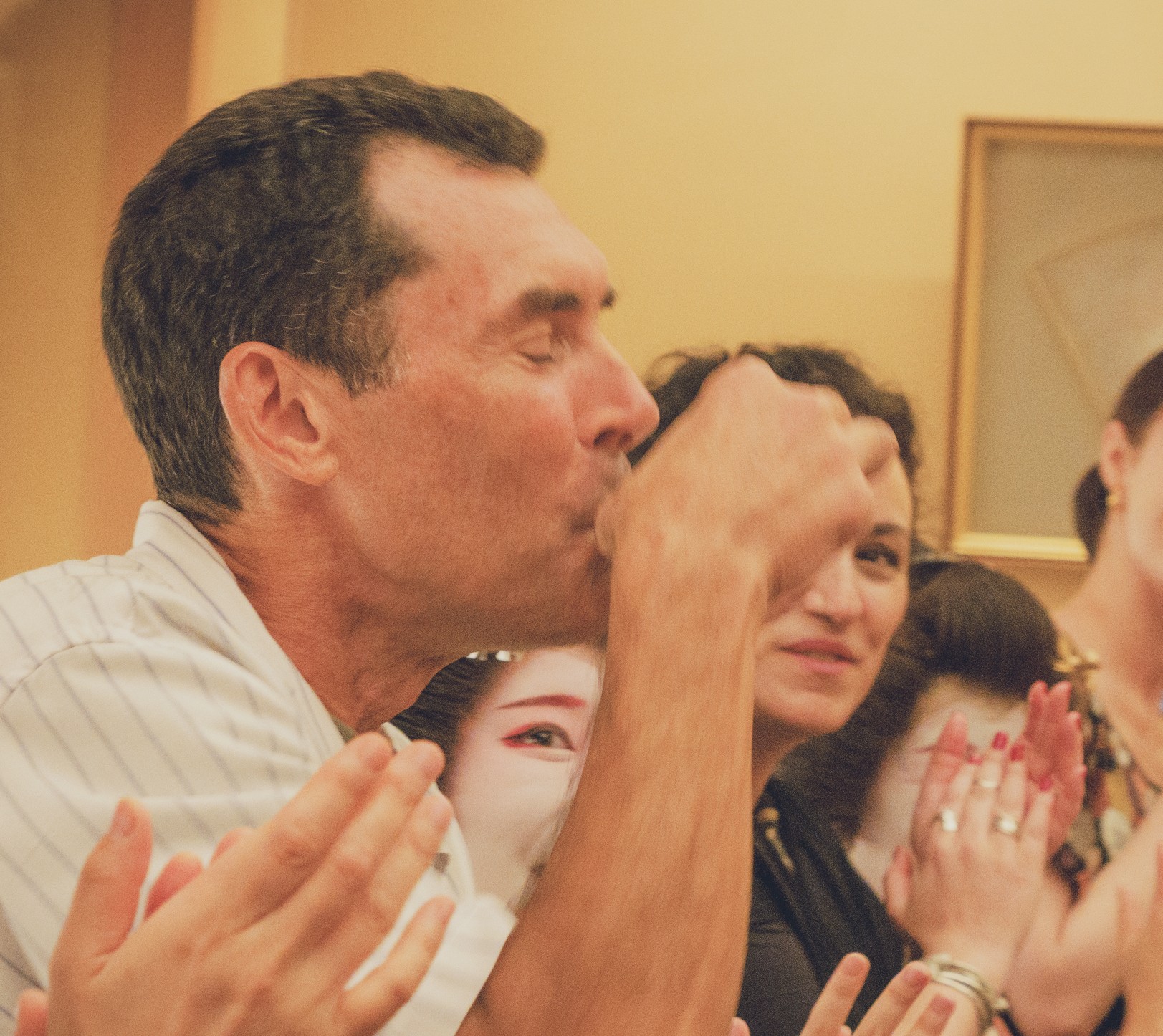 A guest drinks one full small sakazuki cup as the Konpira Fune Fune forfeit at Miyakodori