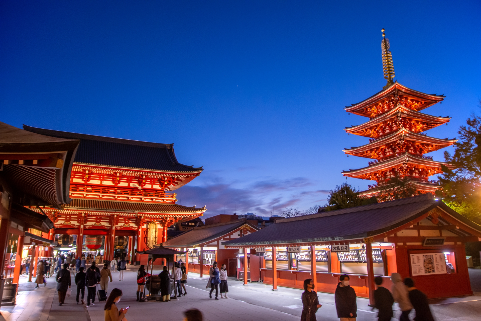 Senso-ji Temple's gate and five-story pagoda illuminated at dusk in Asakusa, Tokyo