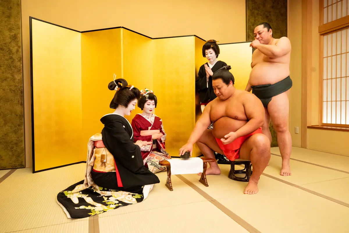 Asakusa geisha and sumo performer playing ozashiki game at Miyakodori