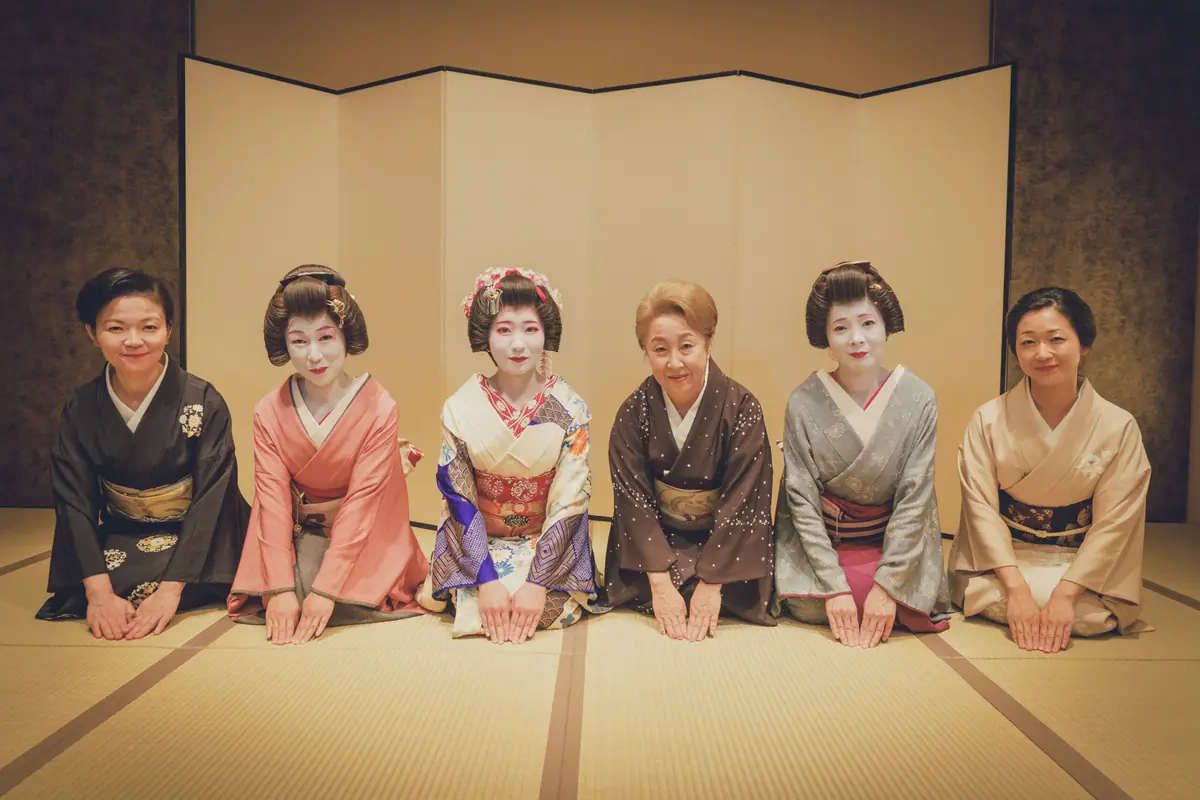 Geisha greeting guests at a private ozashiki banquet room in Asakusa