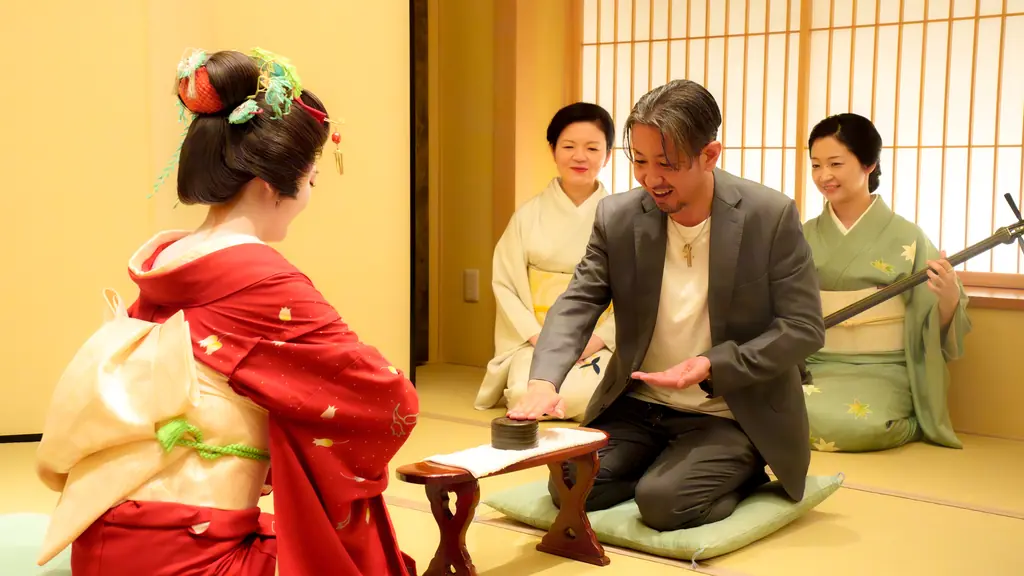 Geisha and guest playing traditional ozashiki game at Asakusa Miyakodori tea house
