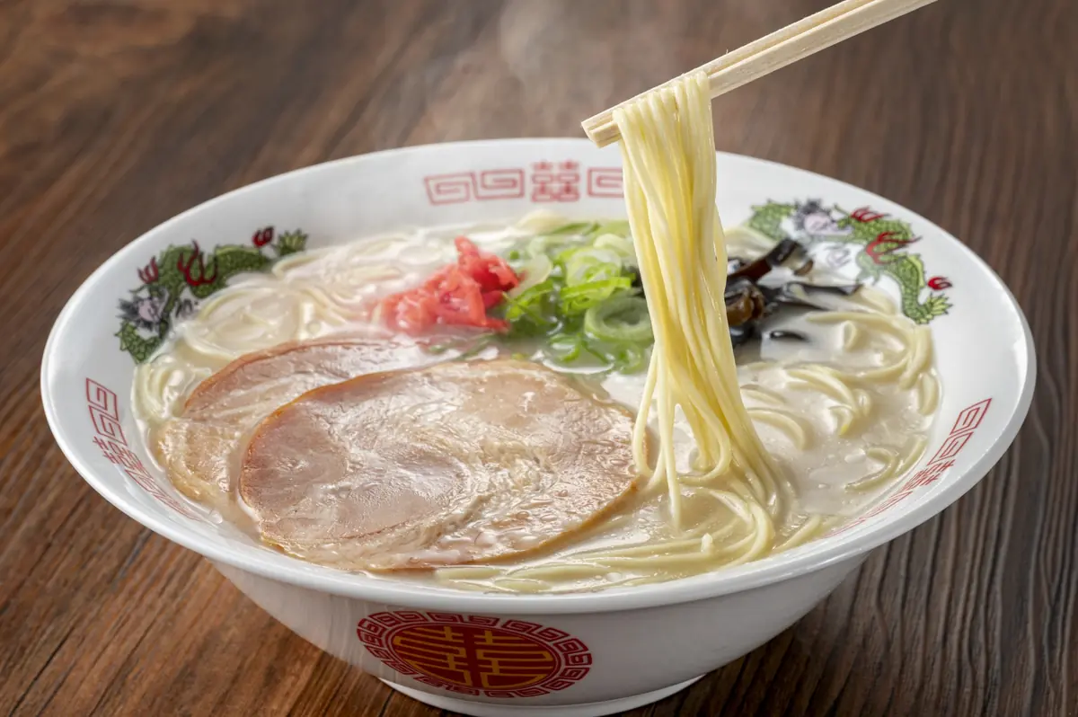 Steaming bowl of Tokyo ramen with rich broth and fresh toppings