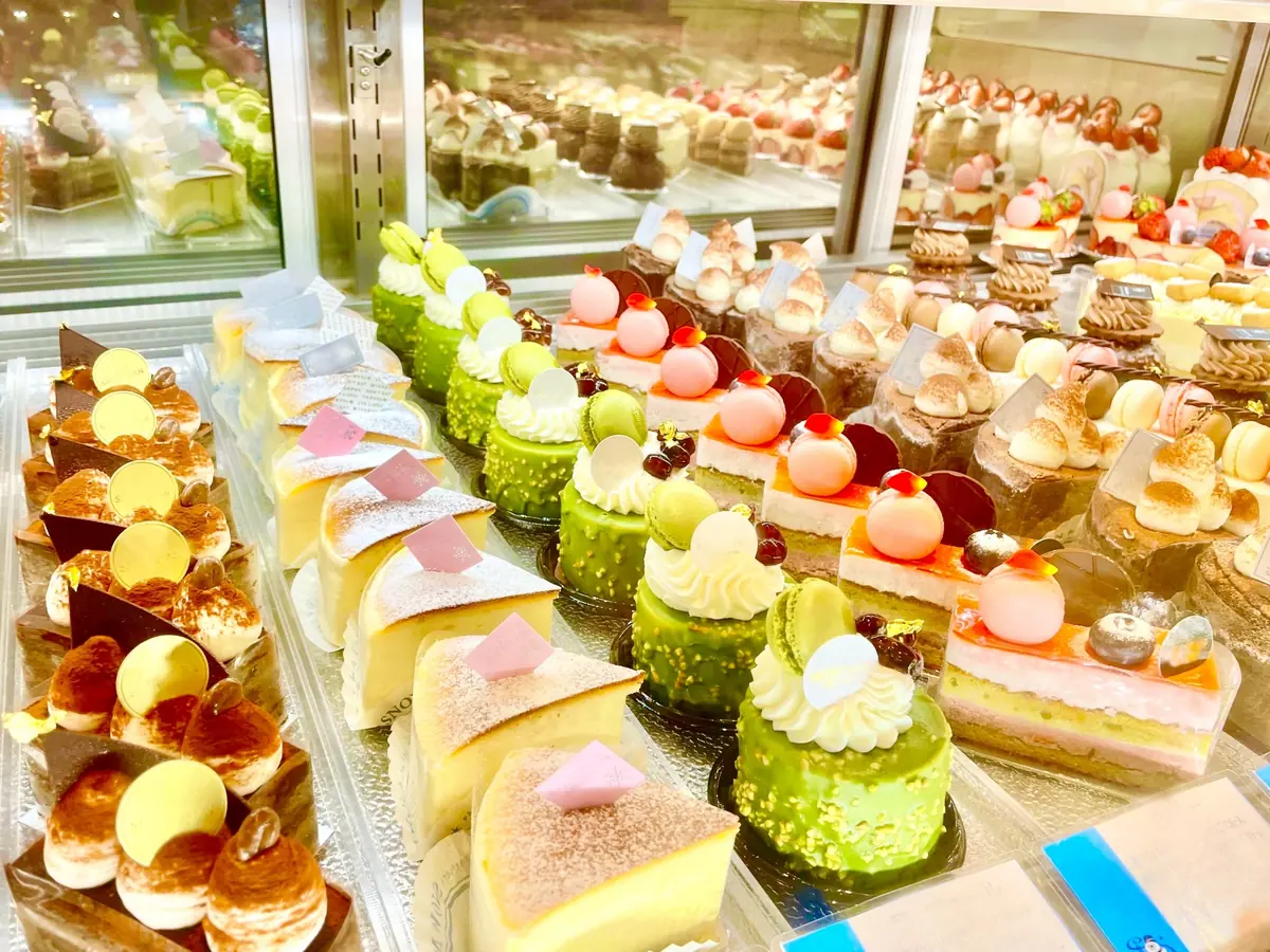 Depachika food hall in Shibuya with rows of bento boxes and sweets