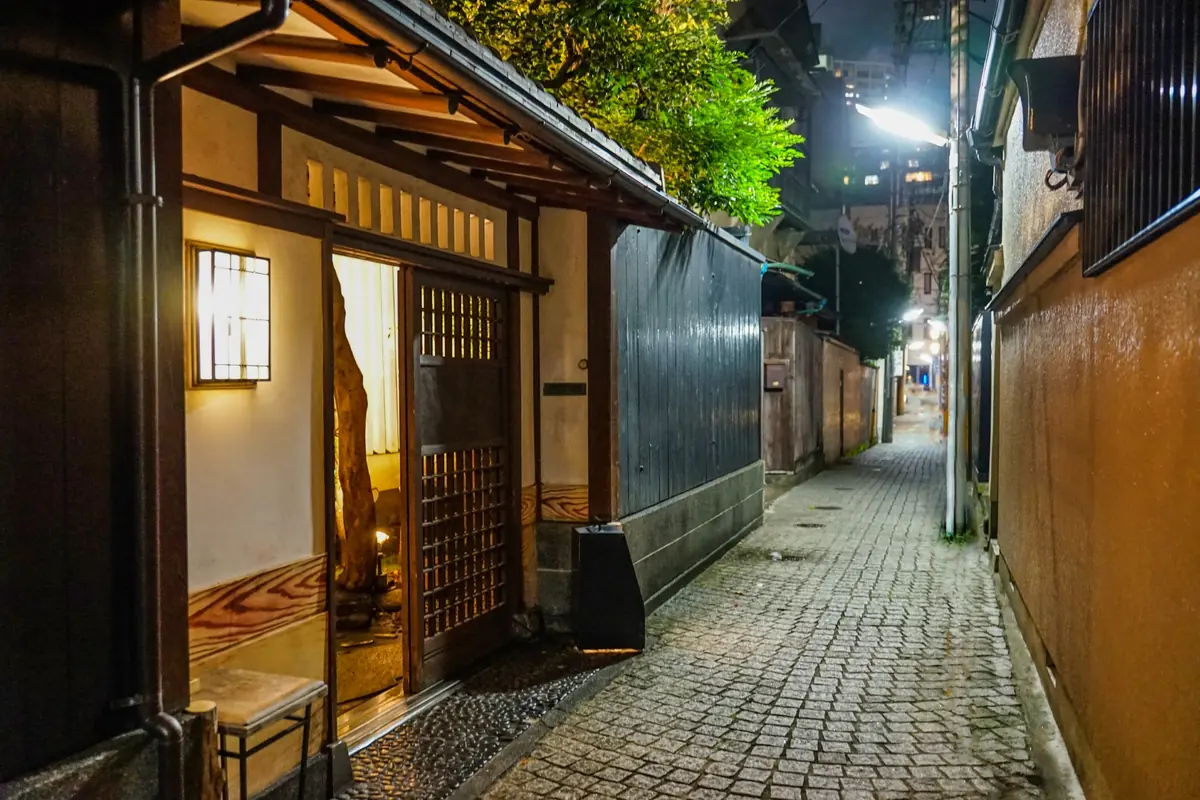 Charming cobblestone alley in Kagurazaka geisha district, blending traditional Japanese architecture with French influence