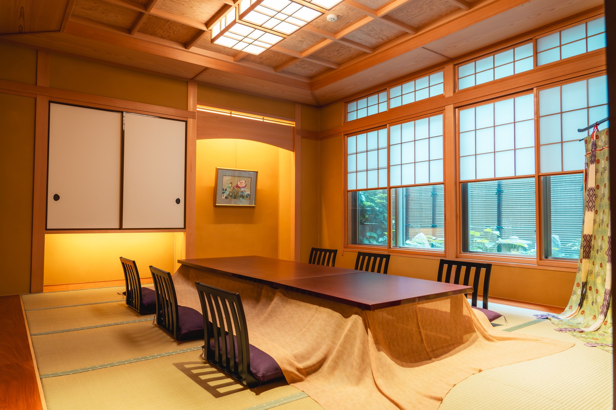 A formal tatami banquet hall with low tables and shoji screens at Miyakodori in Asakusa