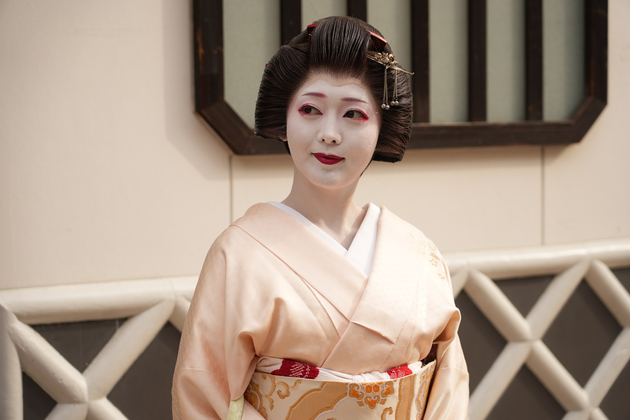 An Asakusa geisha in formal kimono at a traditional ozashiki banquet in Tokyo's Asakusa hanamachi district