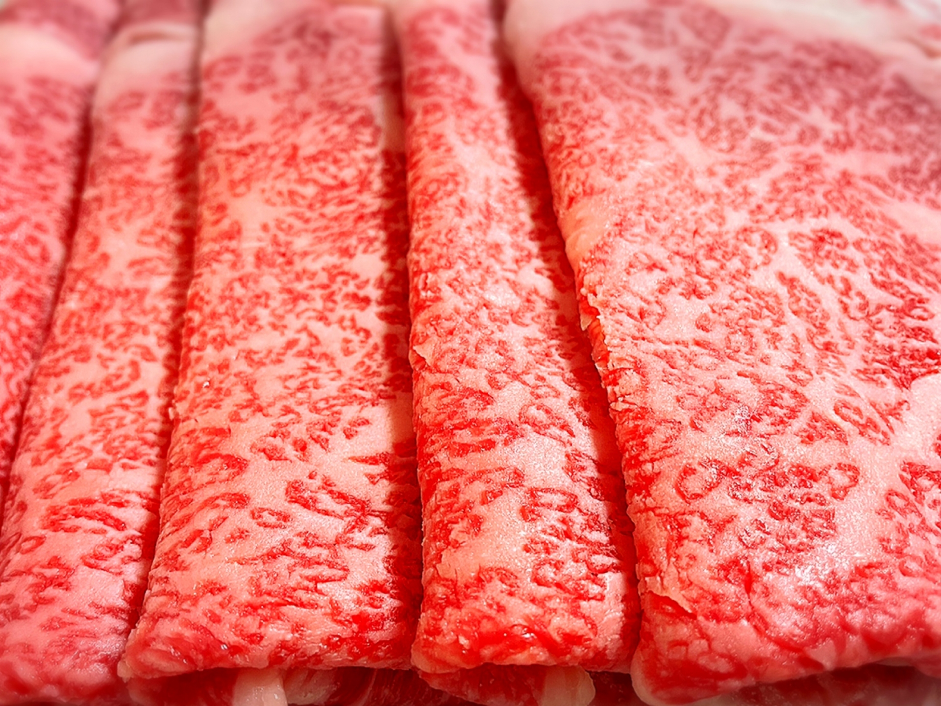 Slices of richly marbled A5 Wagyu beef