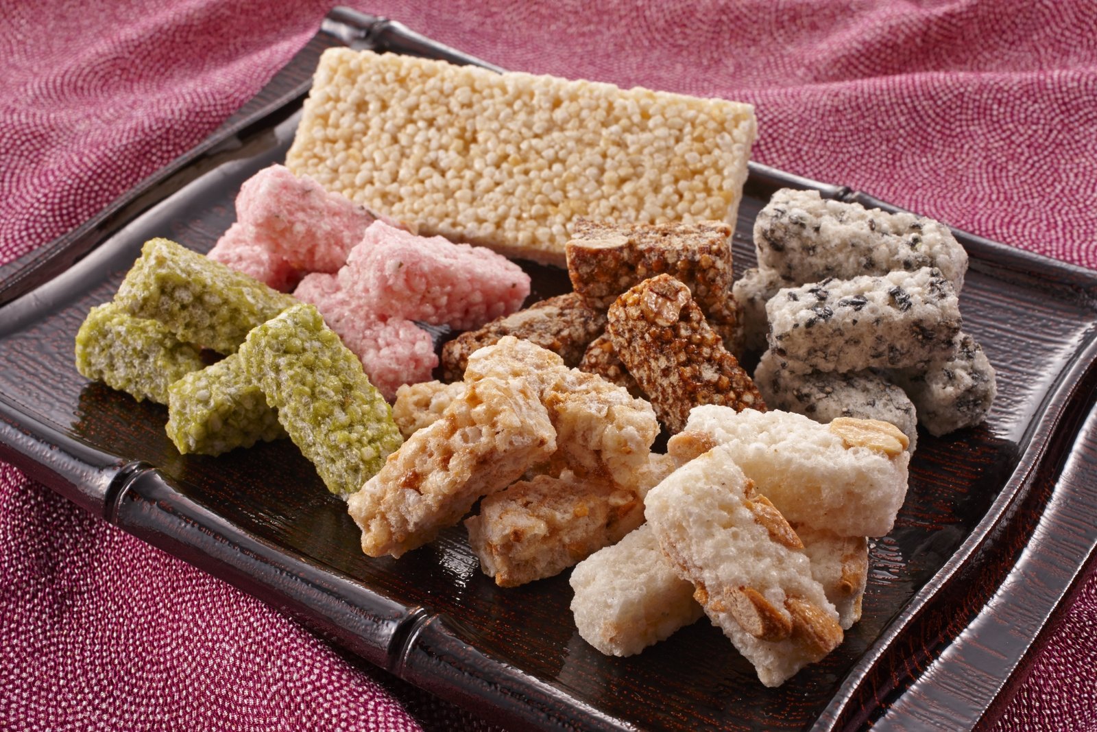 Kaminari-okoshi, Asakusa's classic crisp rice sweet sold along Nakamise, piled in colorful varieties