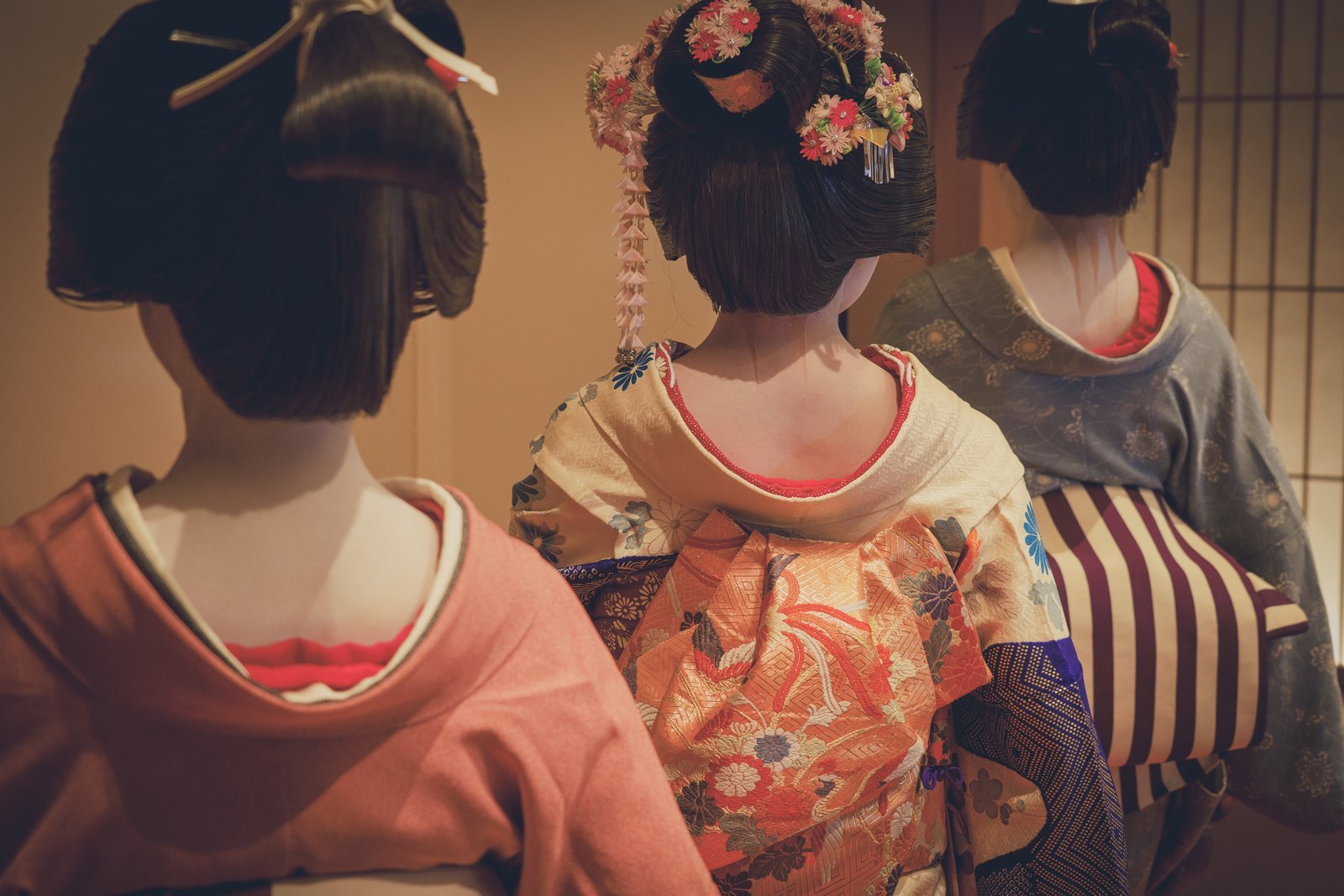 Close-up of an Asakusa geisha's kimono, obi and hair ornaments, showing the Tokyo style rather than the Kyoto maiko look