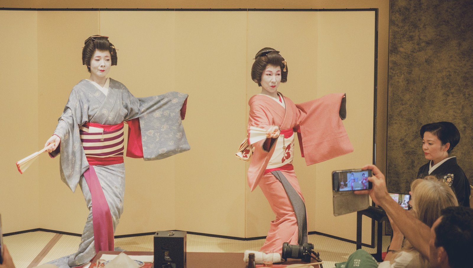 Geisha in kimono performing classical dance during a private ozashiki at Miyakodori in Asakusa