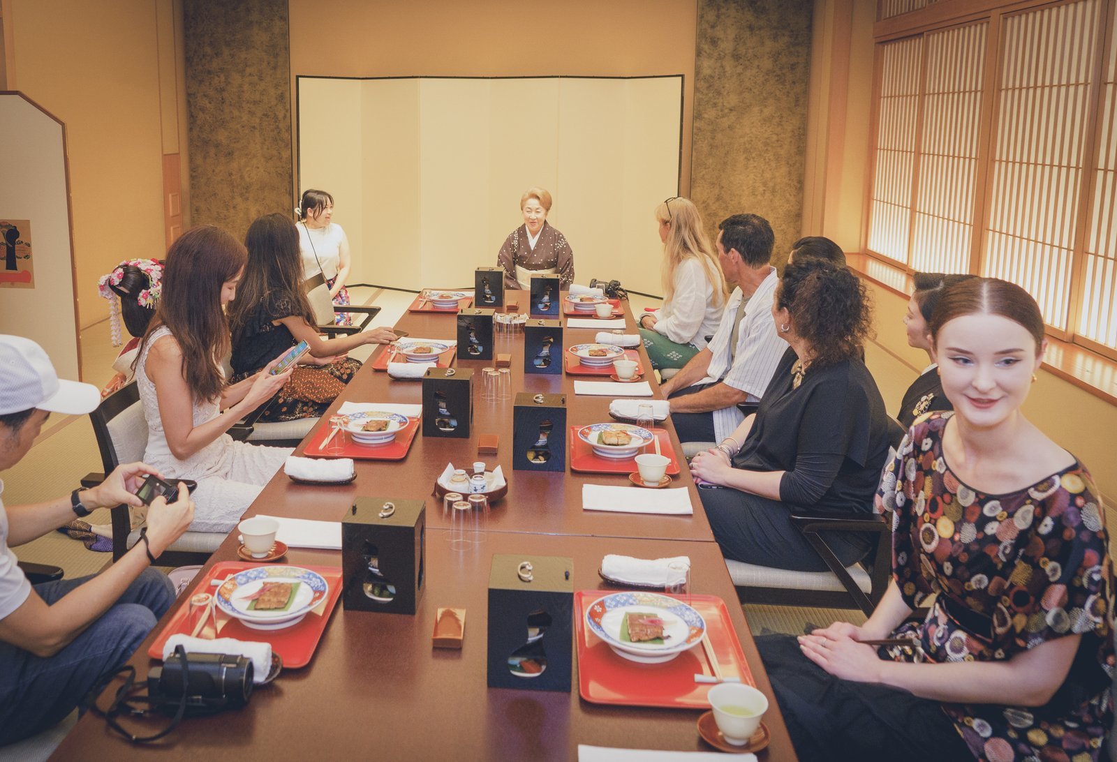 A tatami room at Miyakodori set with low tables and chairs, so guests are not asked to sit seiza