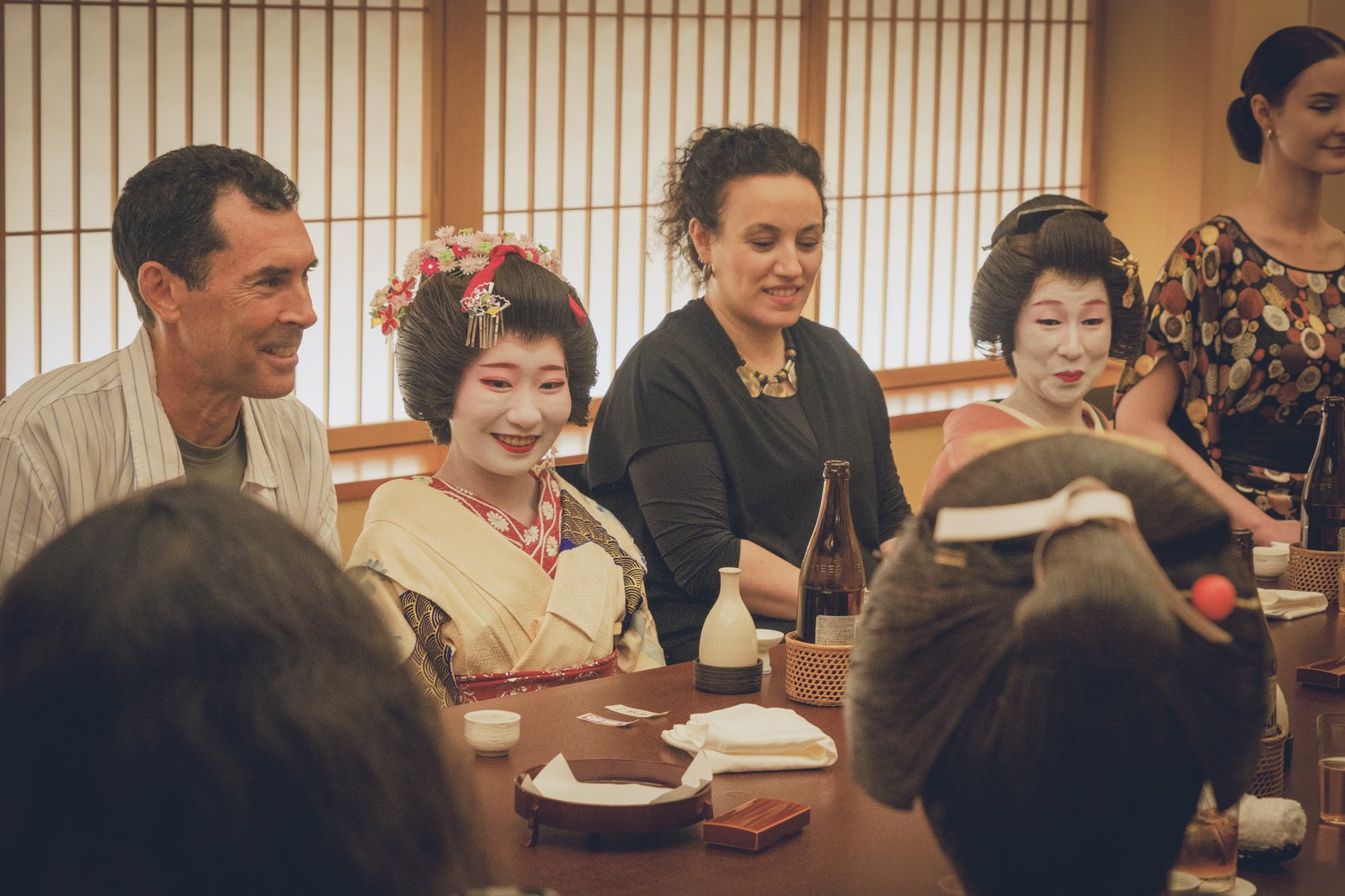 A private party alone with geisha in a tatami room during a private ozashiki (geisha banquet) at Miyakodori
