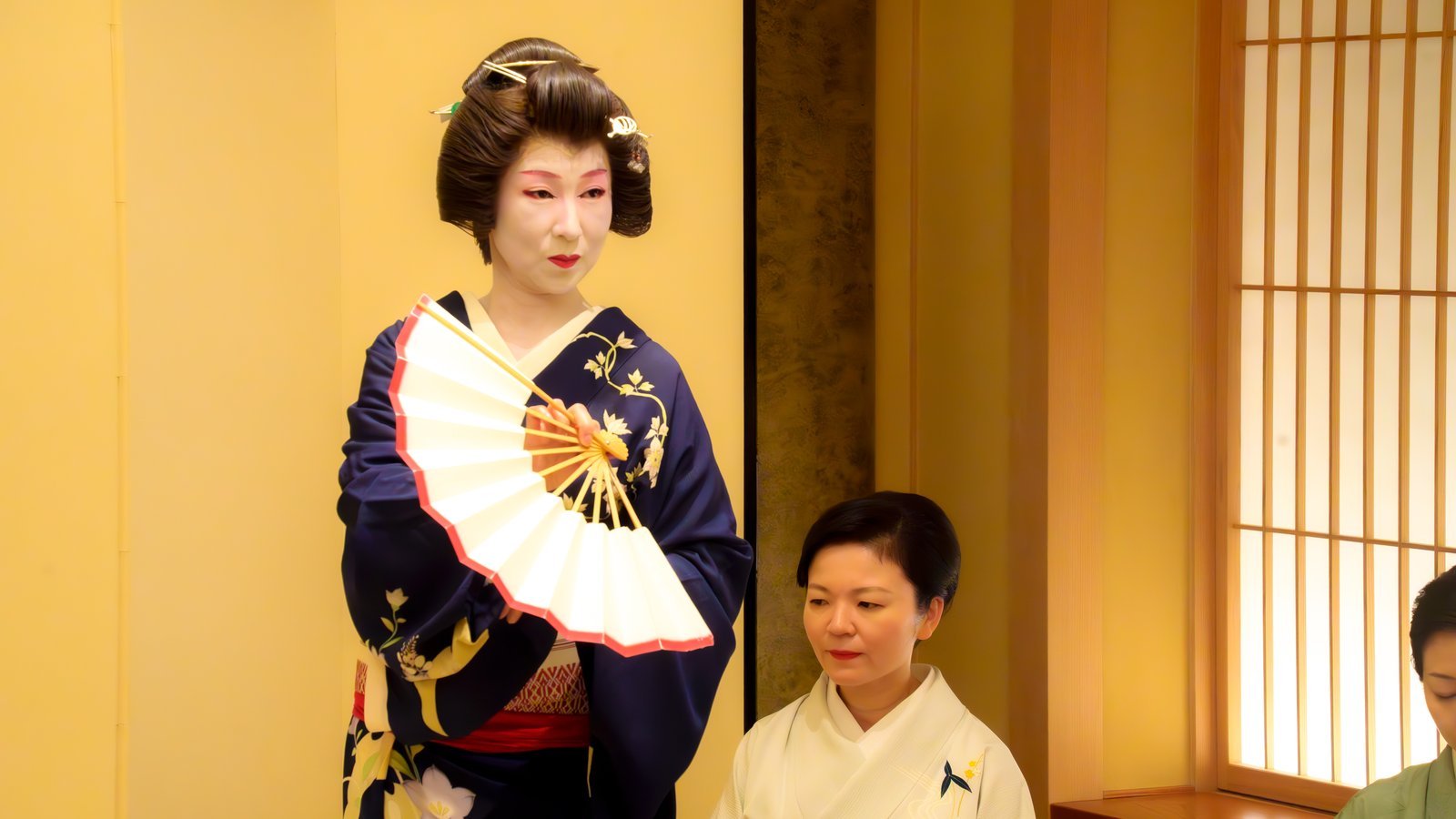 A geisha dancing in the private tatami room at Miyakodori during an ozashiki in Asakusa