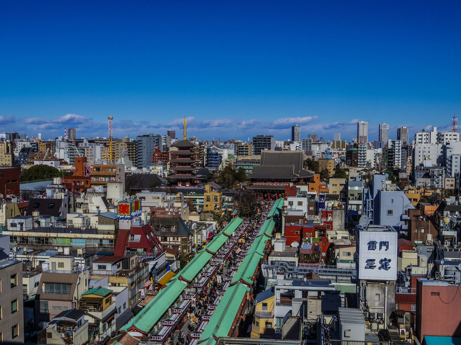 Senso-ji temple and Nakamise shopping street in Asakusa, Tokyo, crowded with visitors