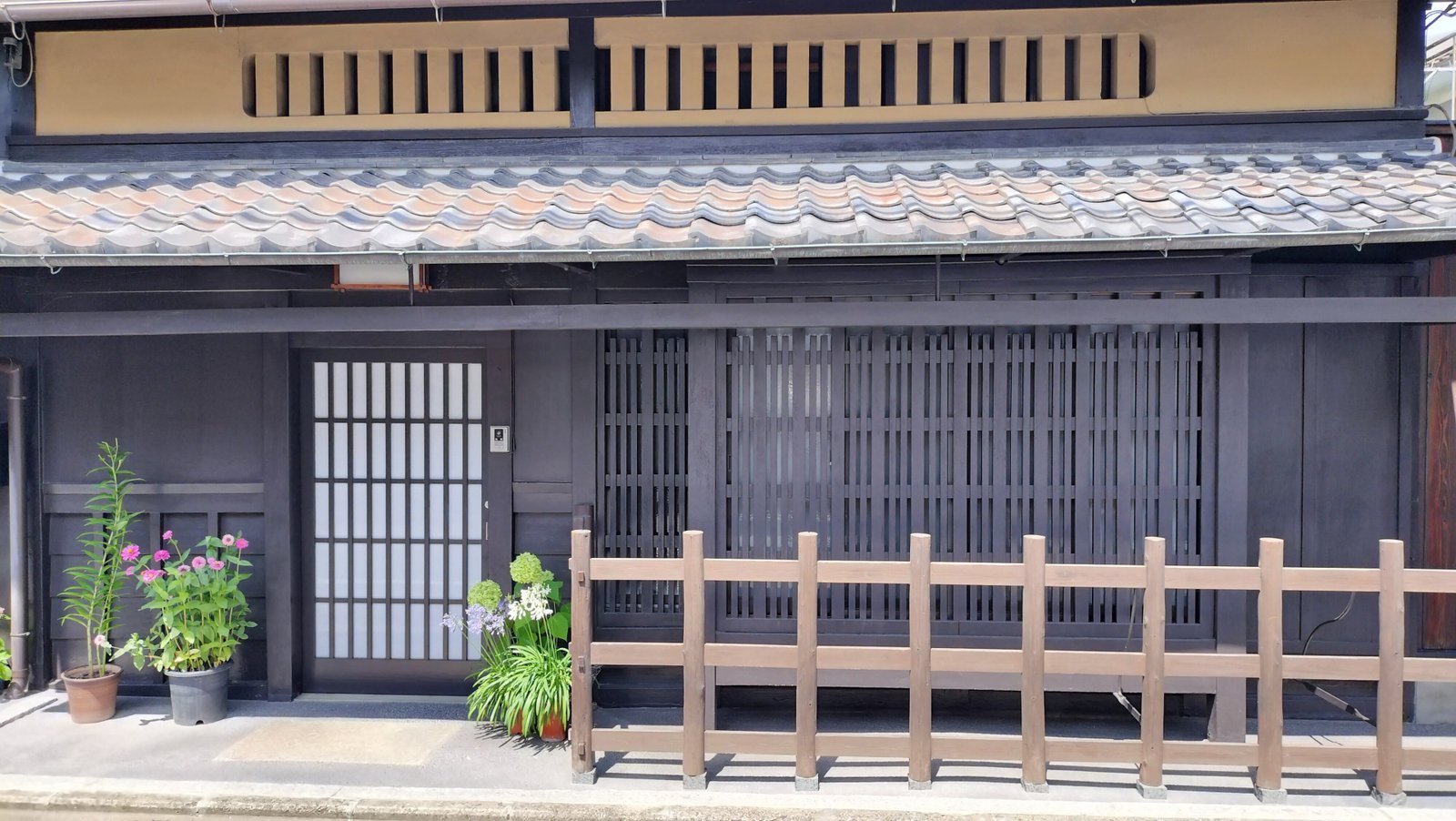 The latticed front of a traditional wooden townhouse in Kyoto