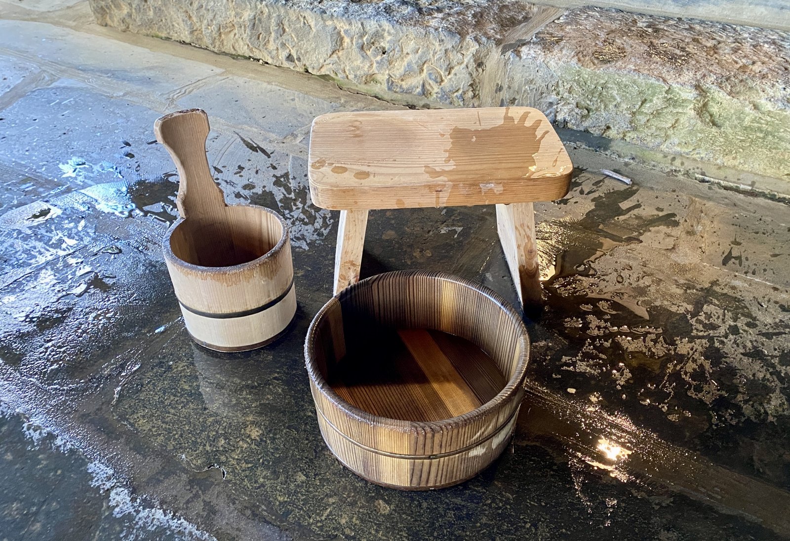 Wooden bath pails and a wooden stool at a Japanese bathhouse