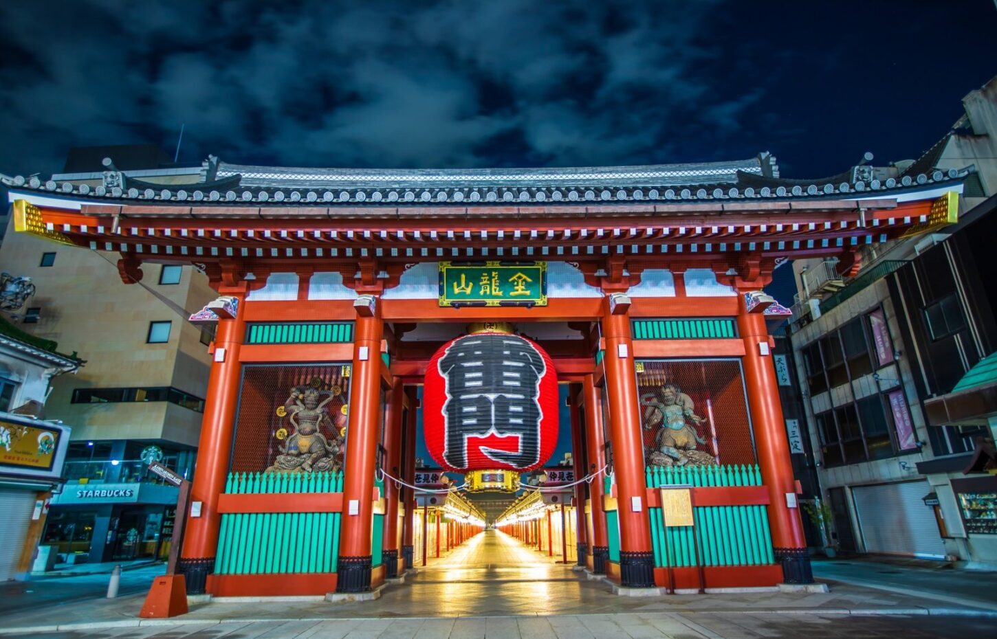 Kaminarimon Gate in Asakusa lit up at night, with Nakamise-dori beyond