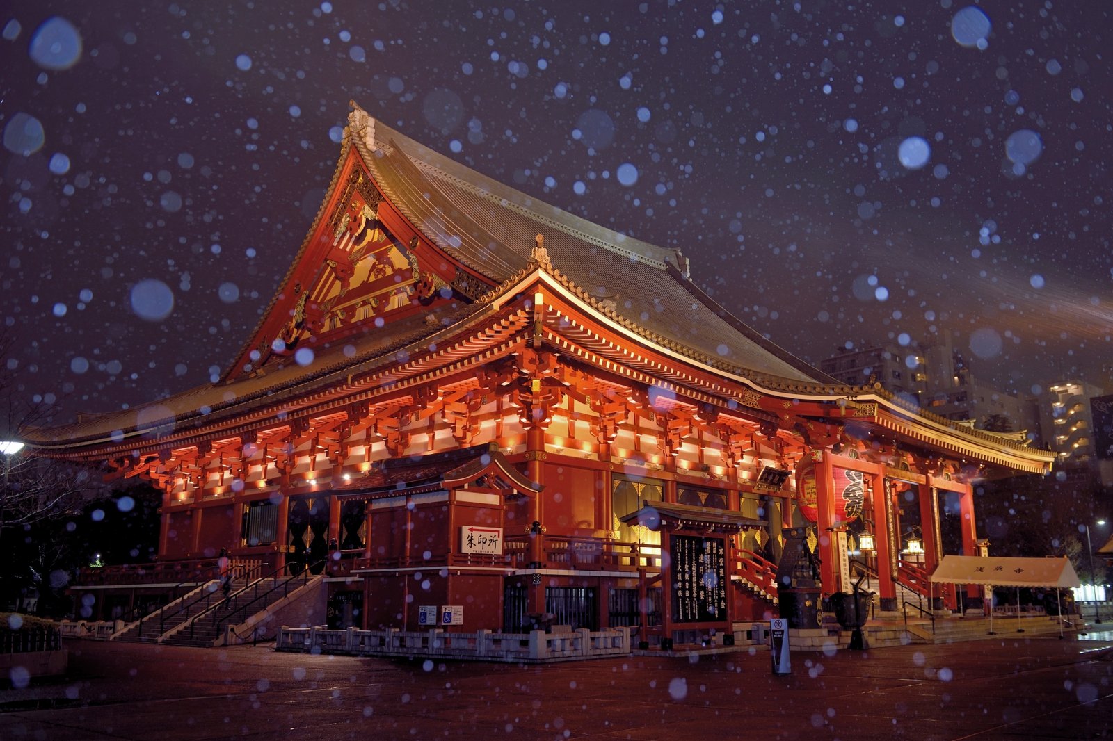 Snow falling on the Main Hall of Senso-ji at night