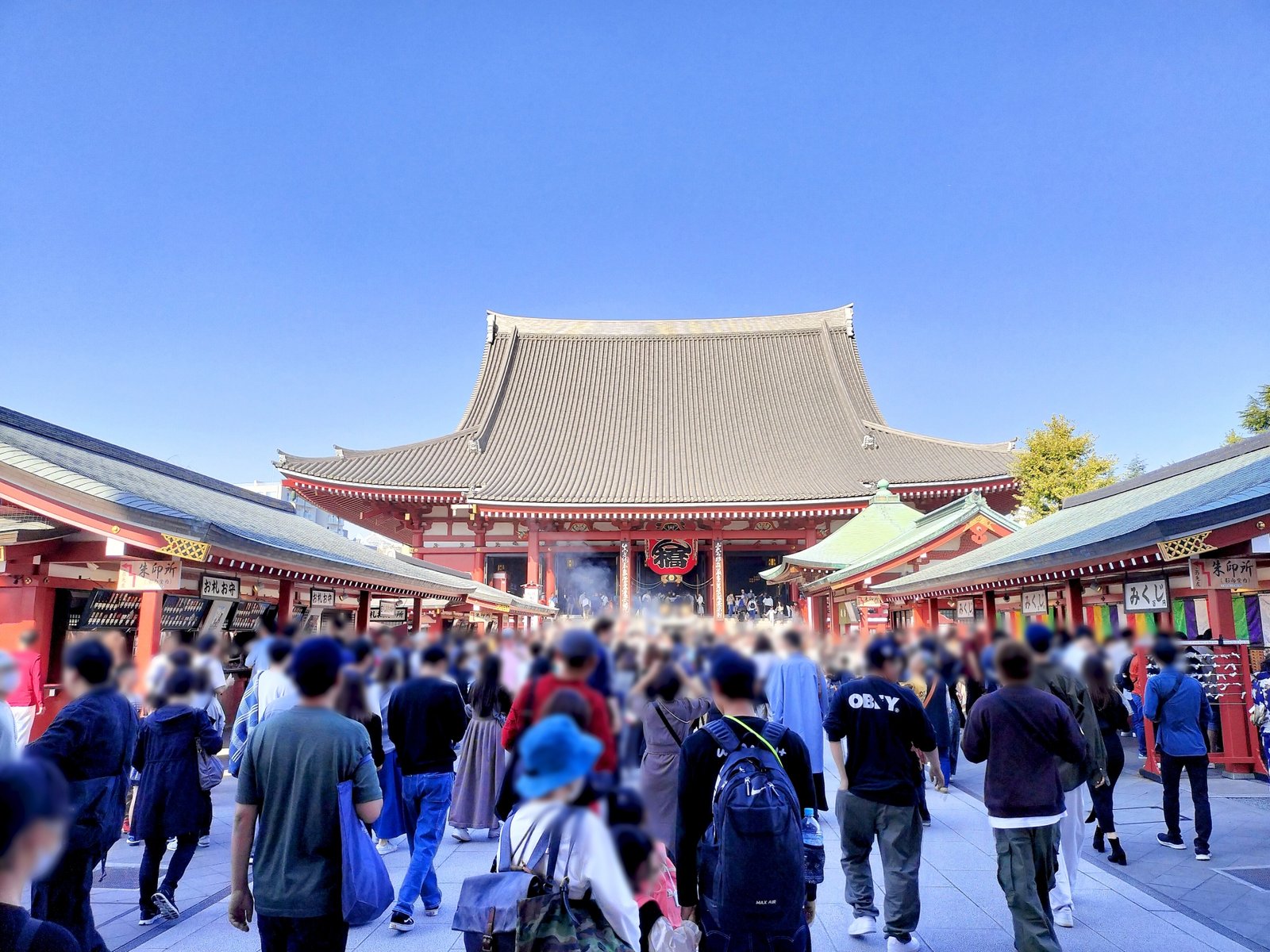 Crowds of visitors walking toward the Main Hall of Senso-ji